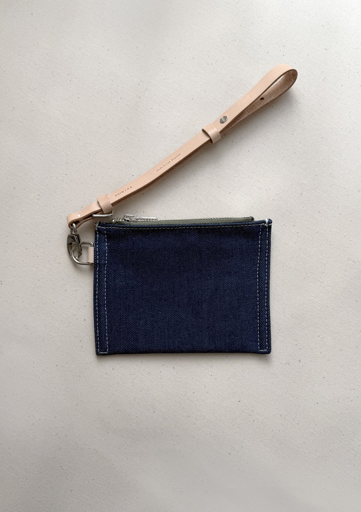The reclaimed canvas small flat pouch in denim