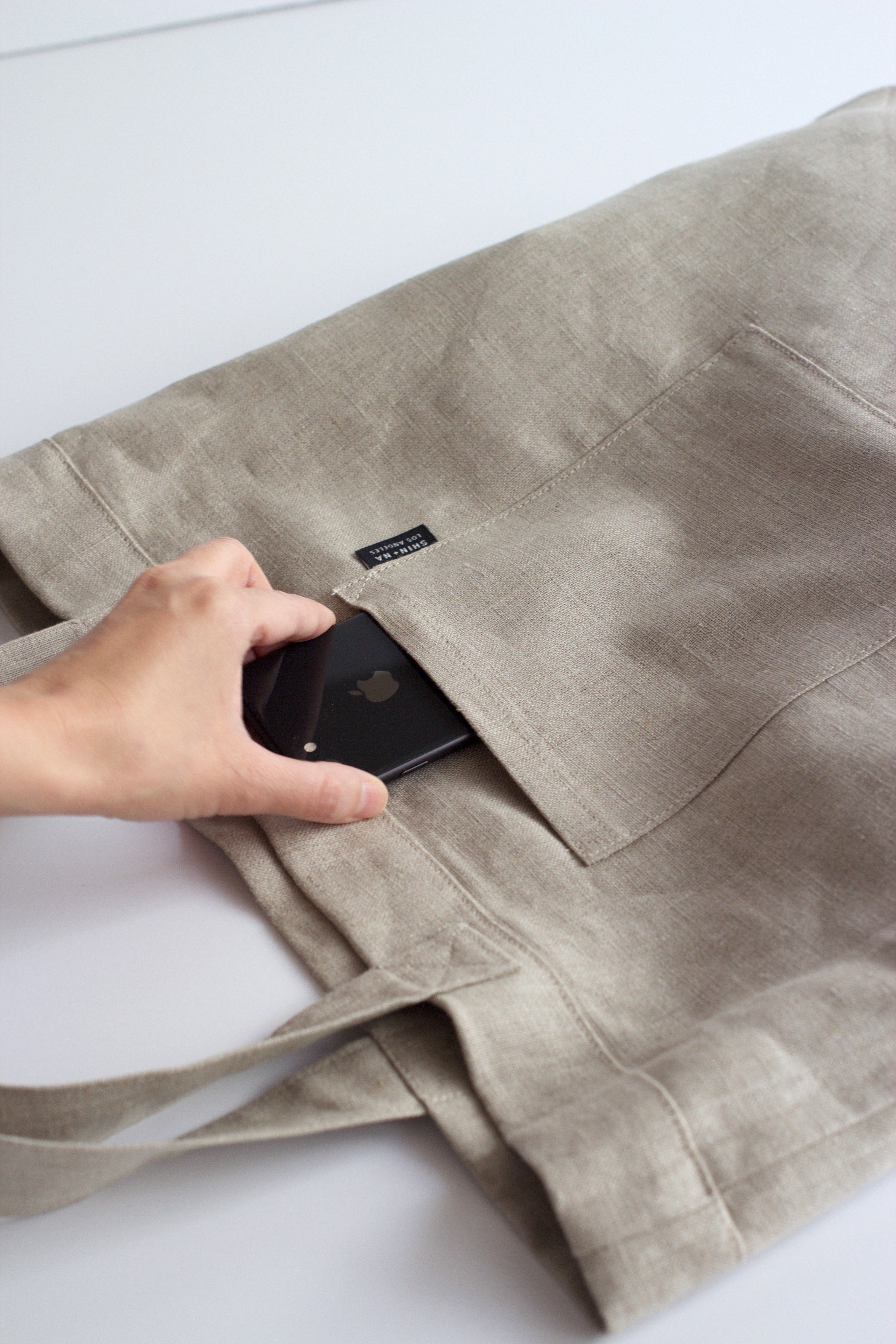 Display of grabbing cell phone from pocket one