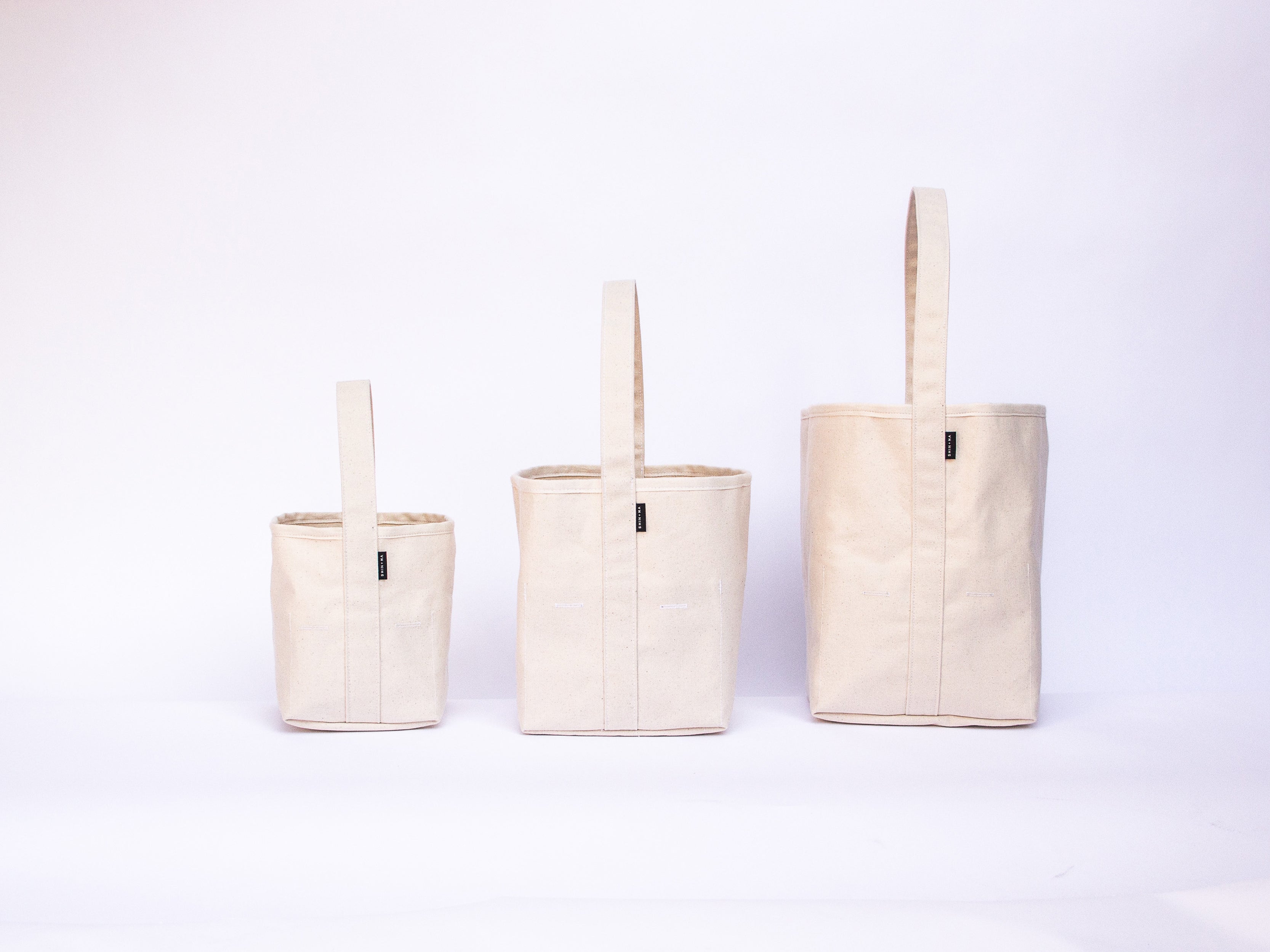 THE REVERSIBLE BUCKET TOTE