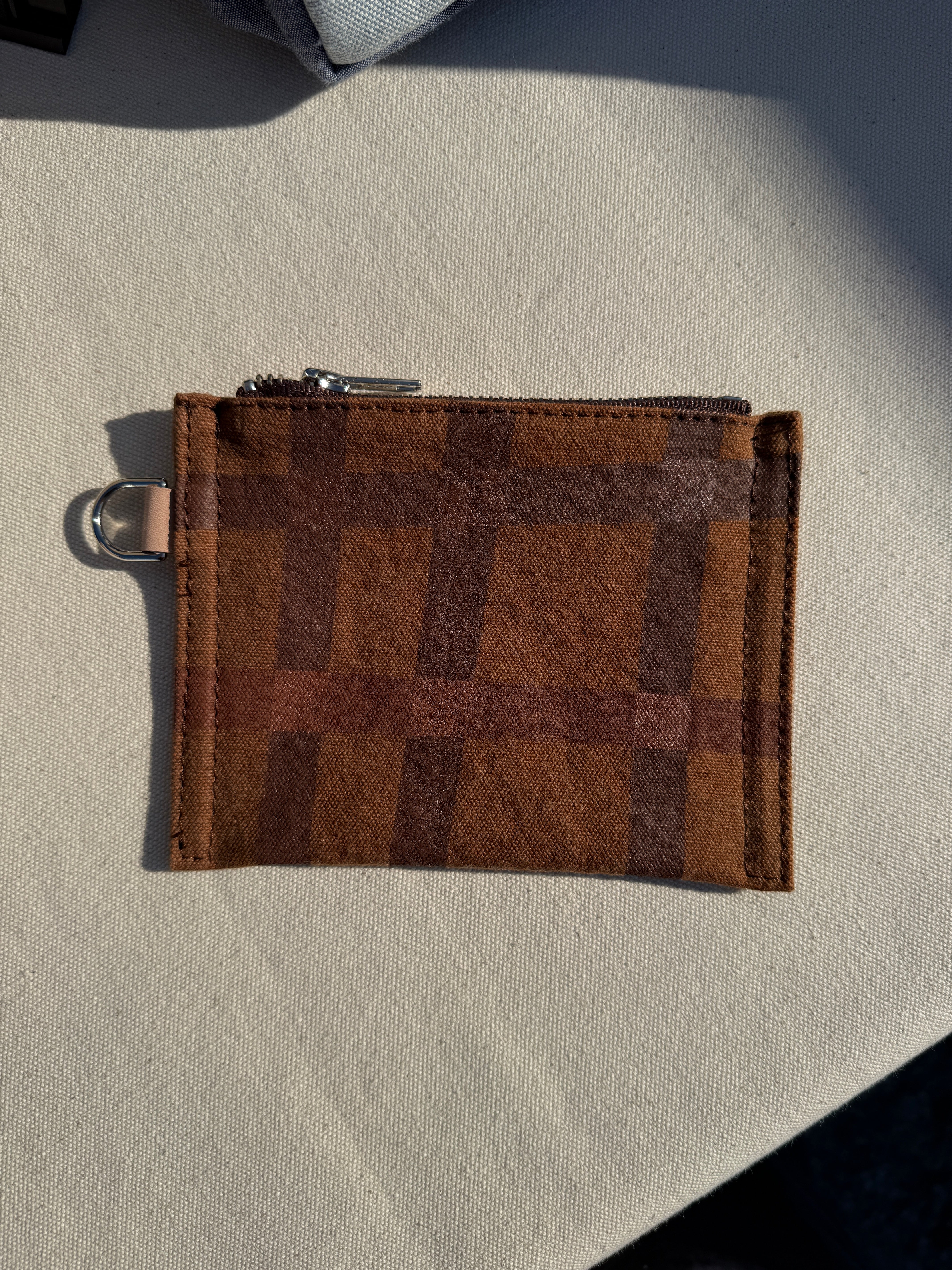 The reclaimed canvas small flat pouch in cognac brown canvas