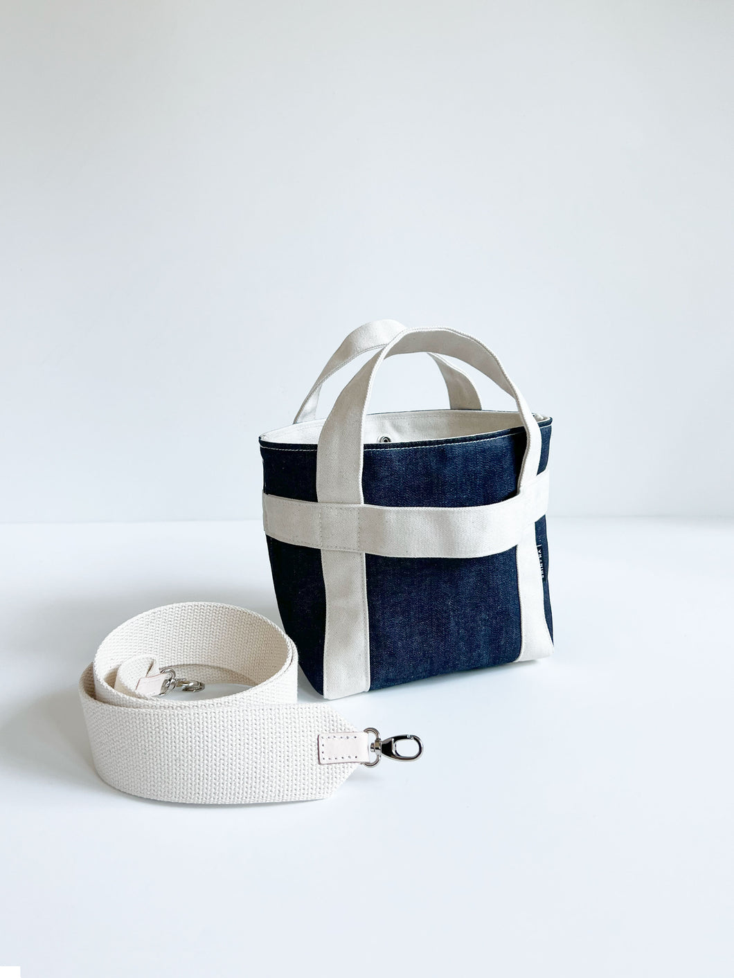 THE CROSSBODY MINI CANVAS TOTE in Dark Blue Denim