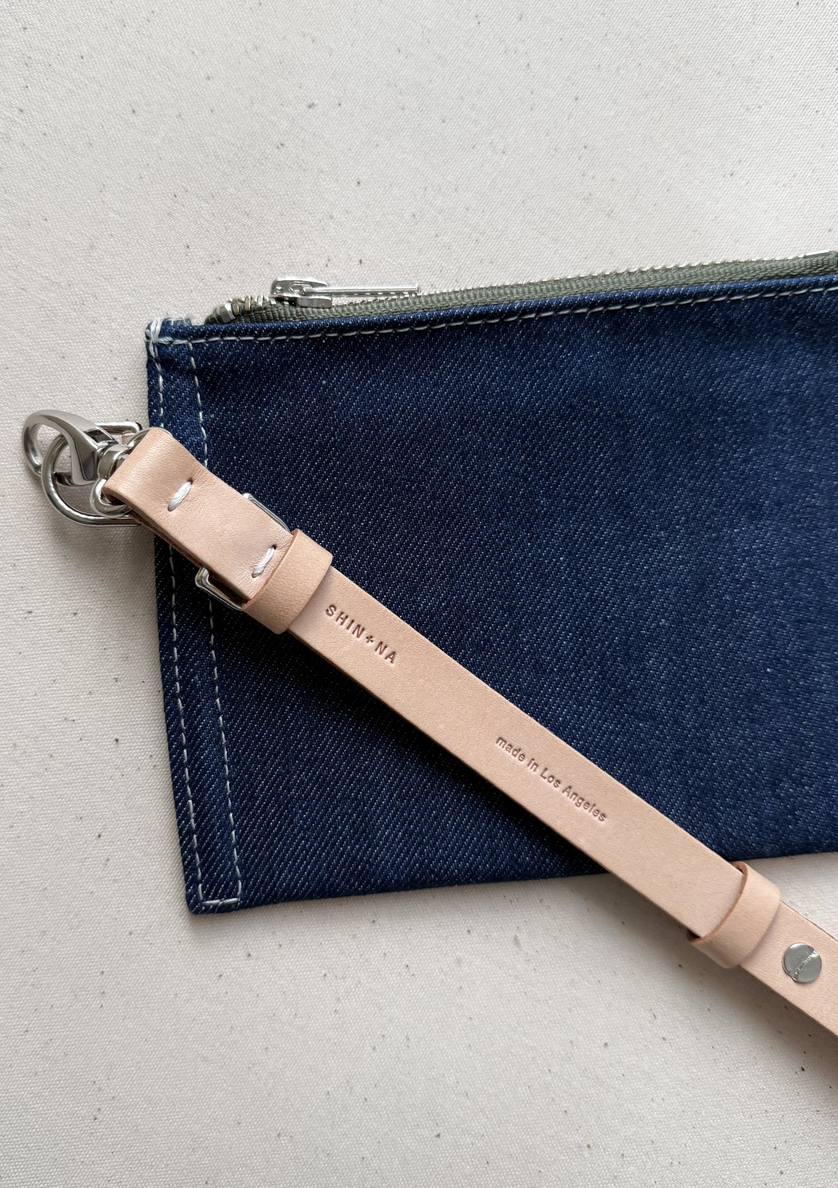 The reclaimed canvas small flat pouch in denim