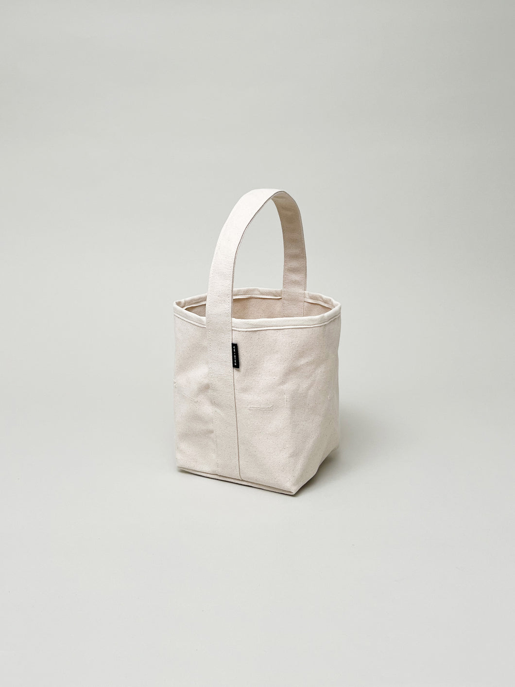 THE SMALL  REVERSIBLE BUCKET CANVAS TOTE
