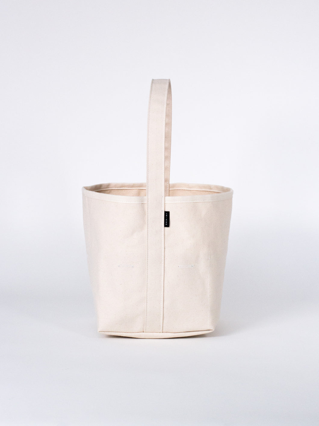 THE REVERSIBLE BUCKET CANVAS TOTE