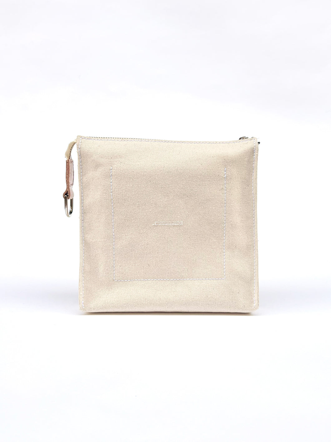 THE CONVERTIBLE CANVAS CLUTCH in natural